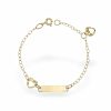 a gold bracelet with a gold bar and a heart shaped charm