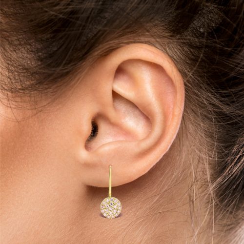 a close up of a ear with earrings